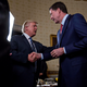 President Donald Trump shakes hands with James Comey, then director of the FBI, in the Blue Room of the White House on Jan. 22, 2017, in Washington, D.C.